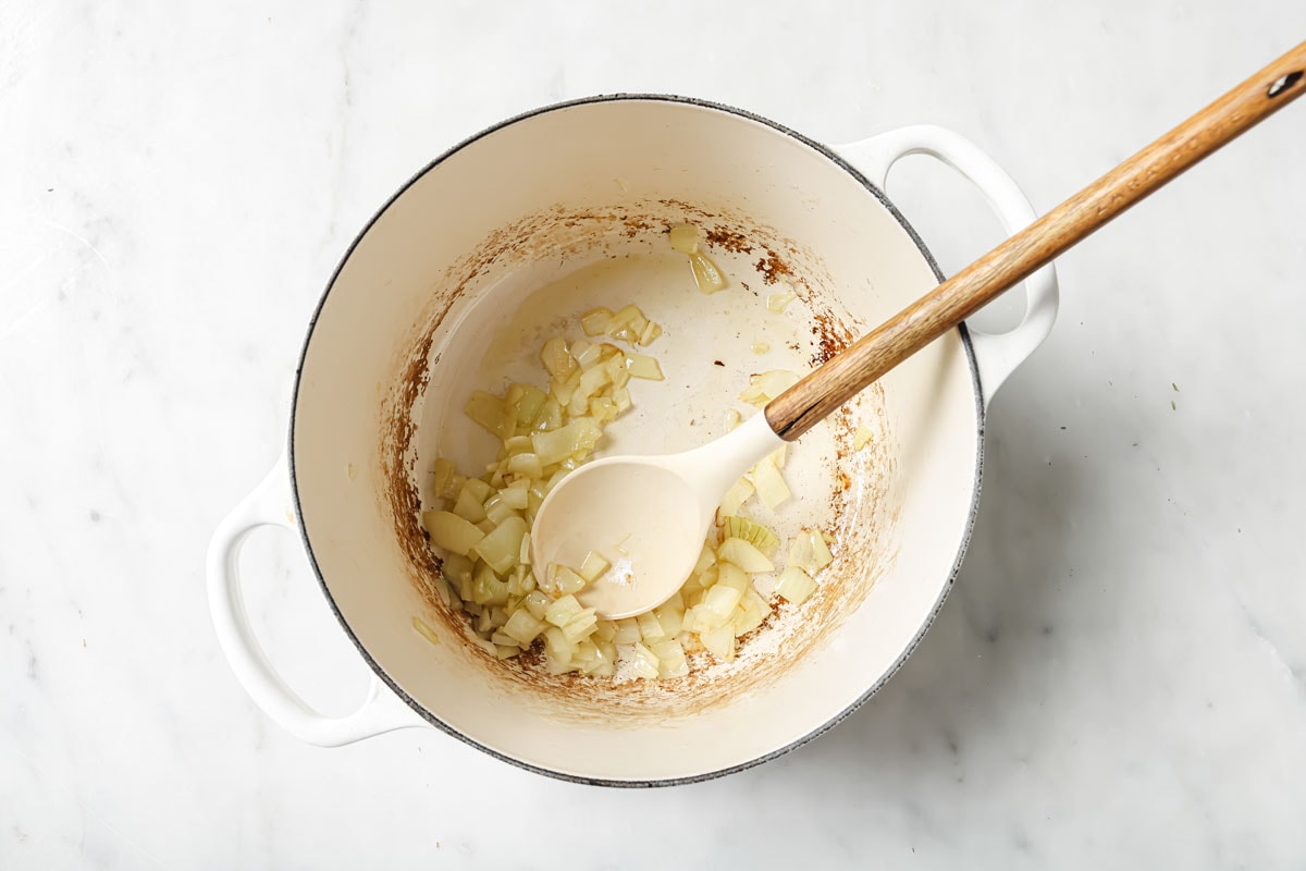 Sauteeing onions in a pot.