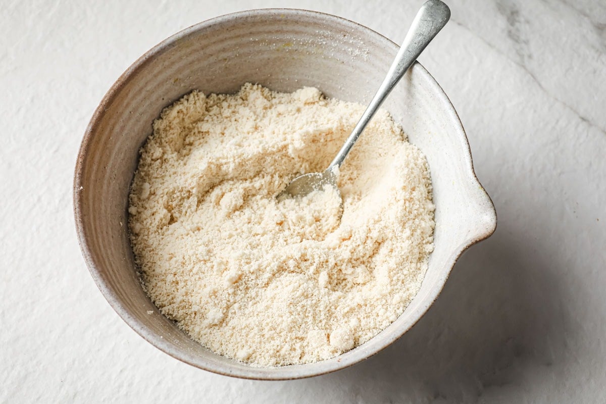 Mixing the dry ingredients in a bowl.