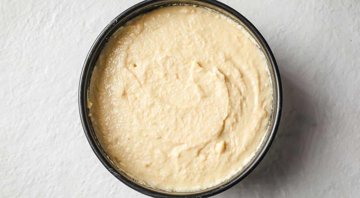 Sugar free sponge cake batter in a springform pan.
