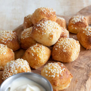 Keto soft pretzel bites on a wooden board.