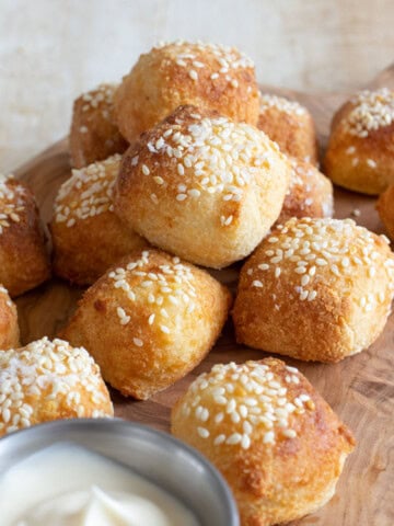 Keto soft pretzel bites on a wooden board.