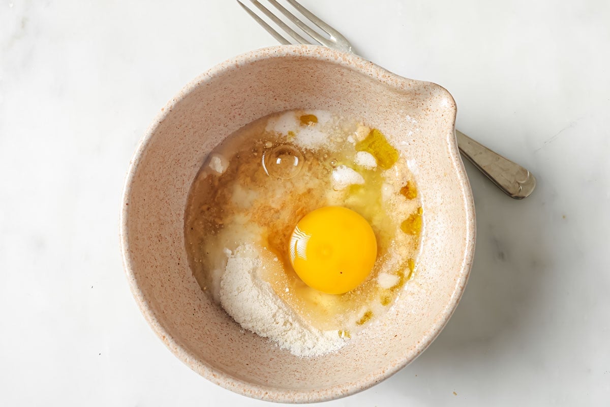 Ingredients for microwave flaxseed bread in a mixing bowl