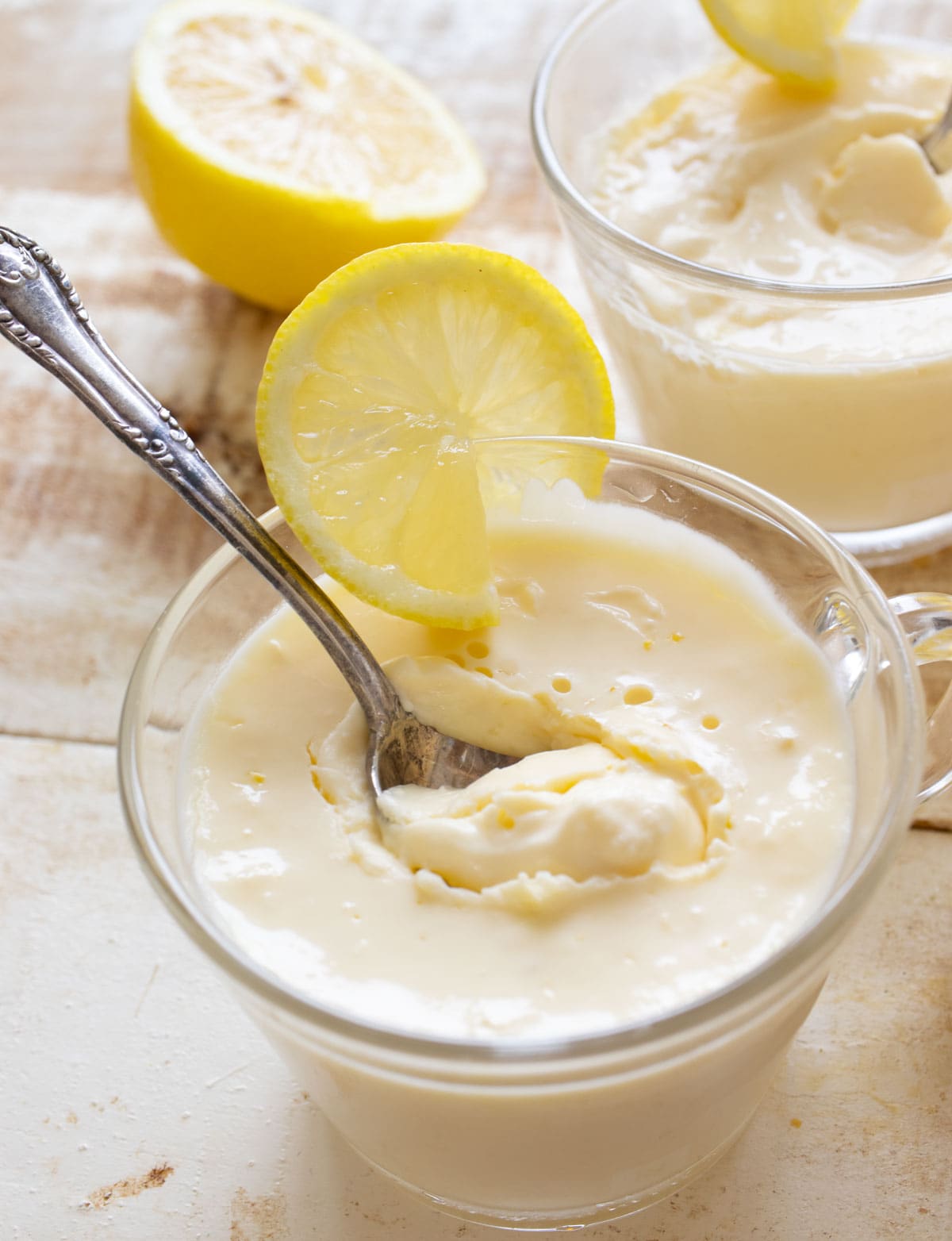 A spoon in a glass with sugar free posset.