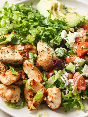 A serving of the Mediterranean chicken salad arranged on a plate.