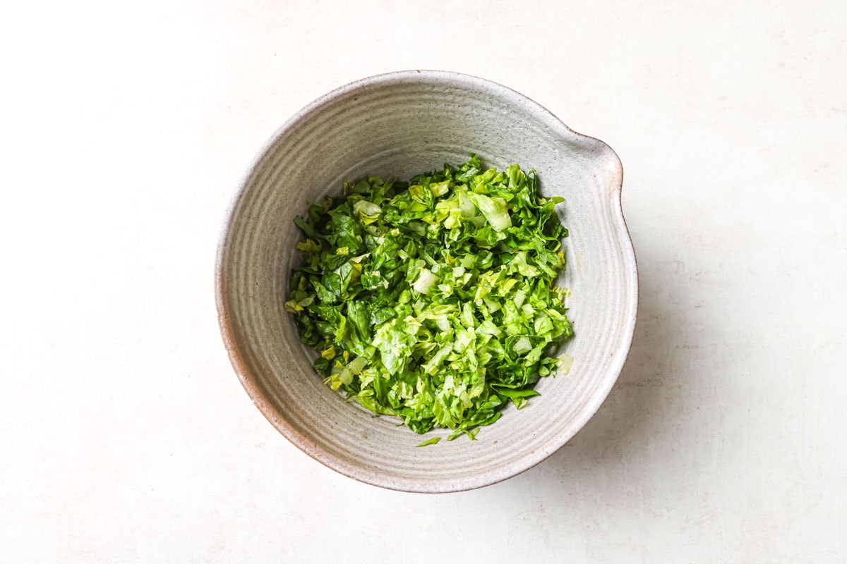 Chopped gem lettuce in a bowl.