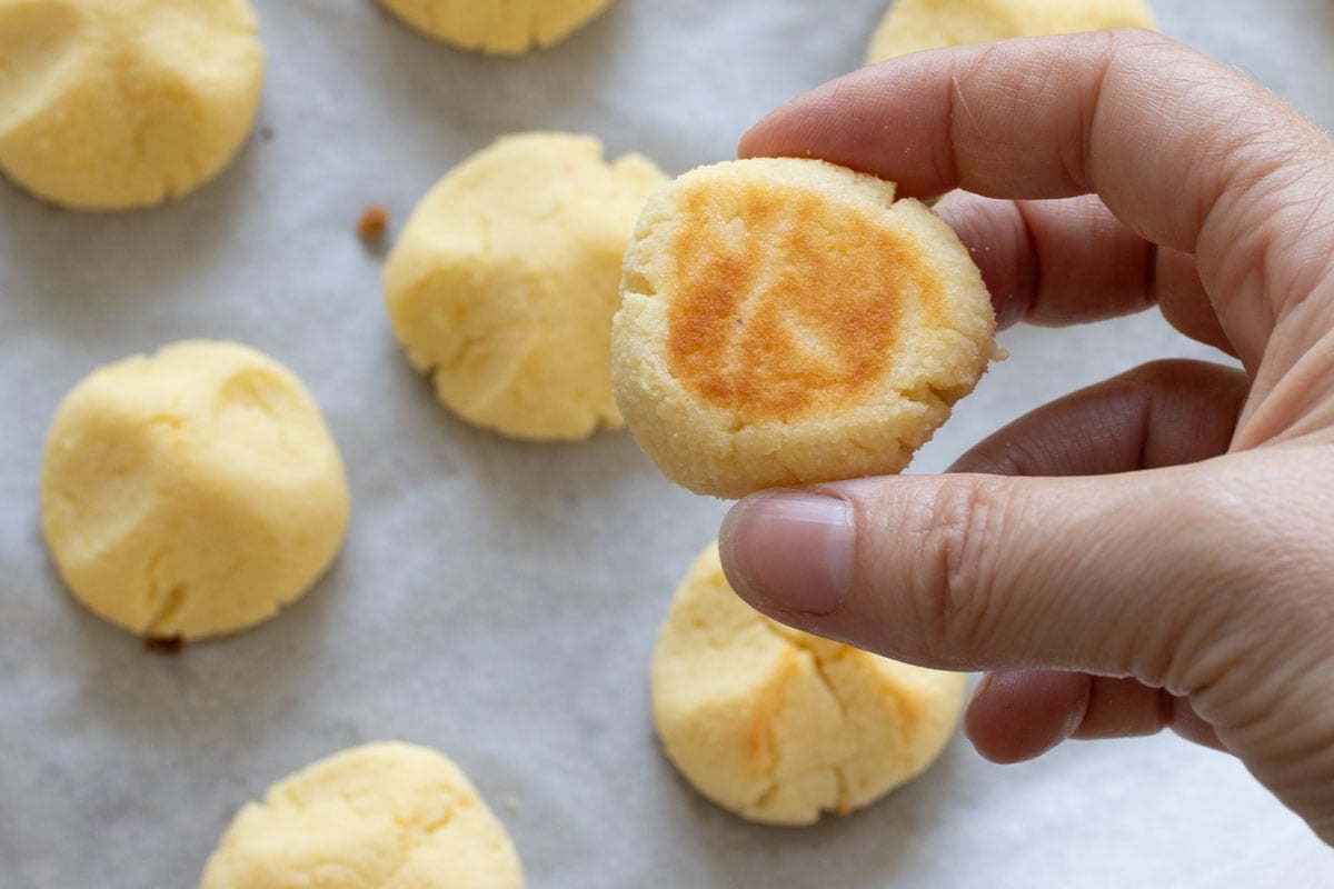 Showing the underside that's browned of a cookie.