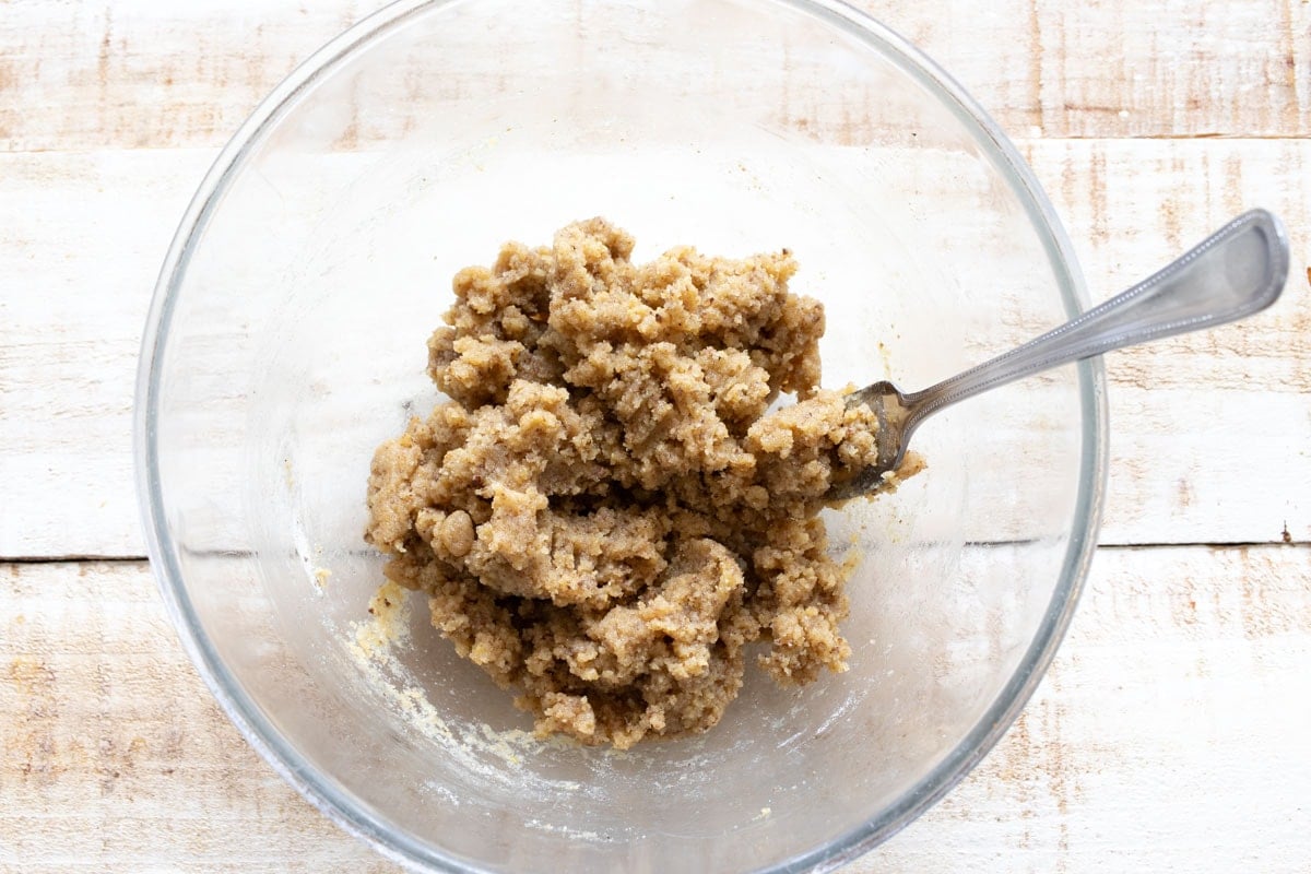 Tahini cookie dough in a bowl with a fork.