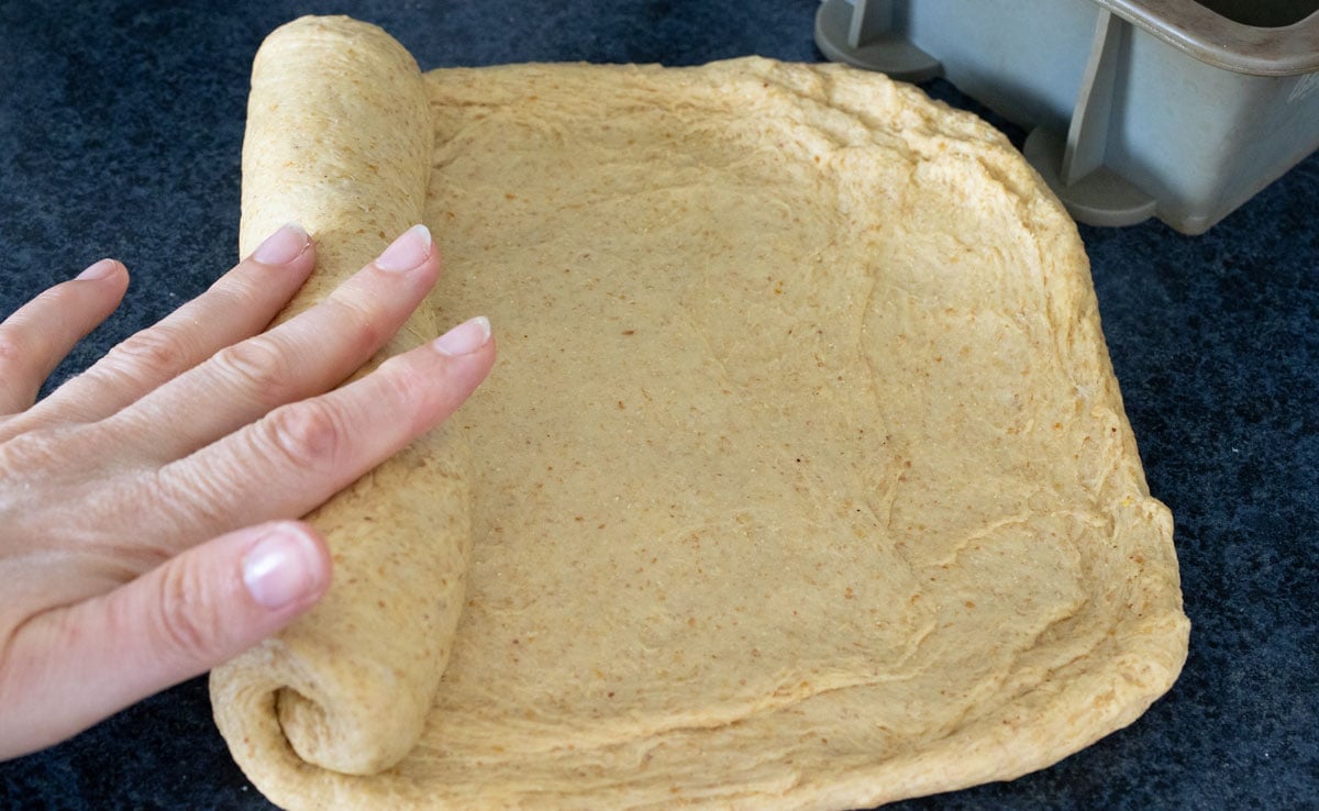 Rolling the dough into a log.