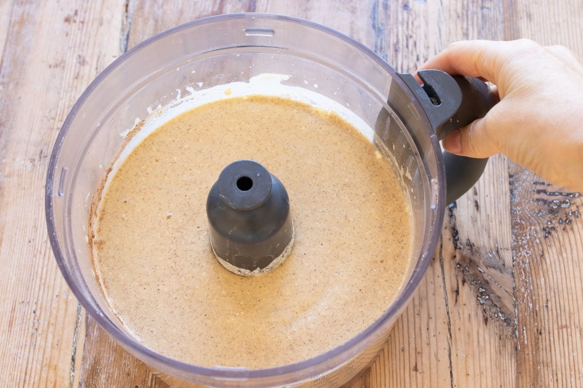 Banana bread batter in a food processor bowl.