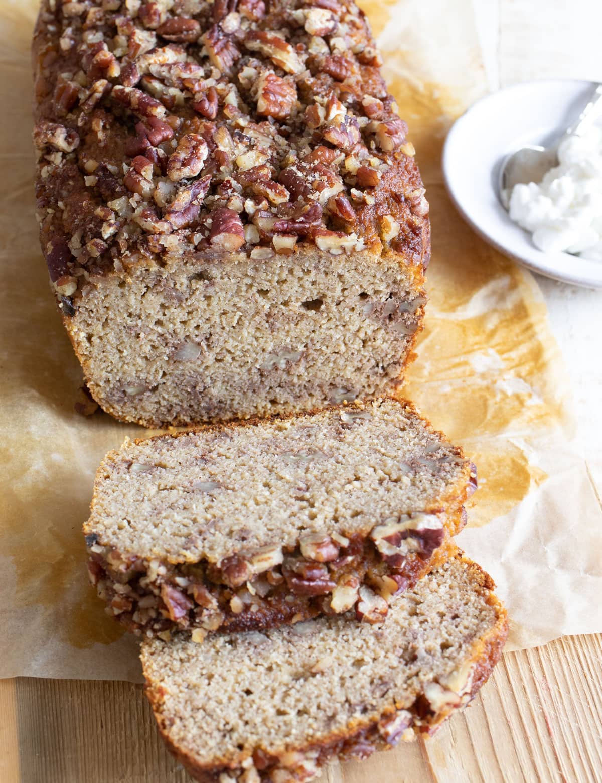 Cottage cheese banana bread on a wooden board, sliced.