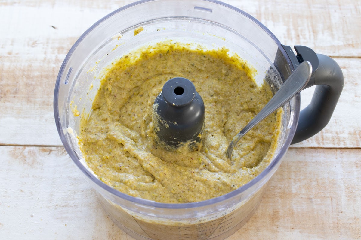 Adding the flours to make the cake batter.