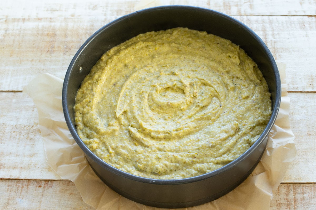 Pistachio cake batter in the springform pan.