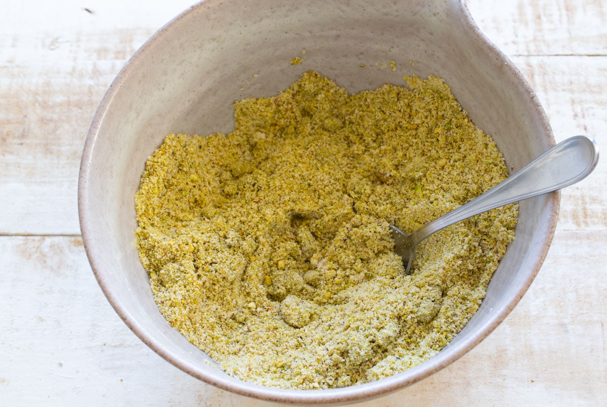 Stirred dry ingredients in a mixing bowl.