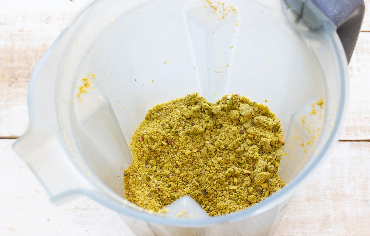 Ground pistachios in a blender.